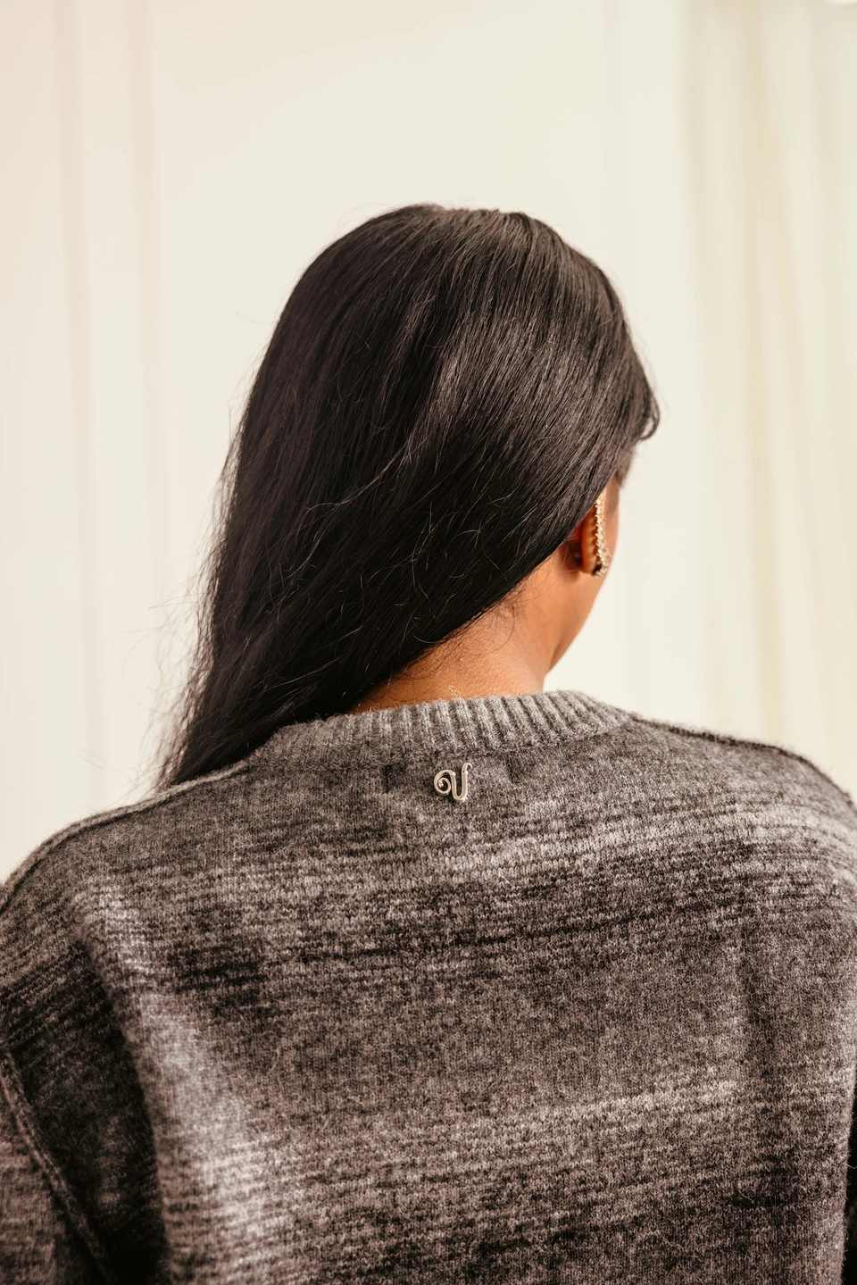 Charcoal Mist alpaca wool gradient knit sweater — back neckline and signature V-logo detail