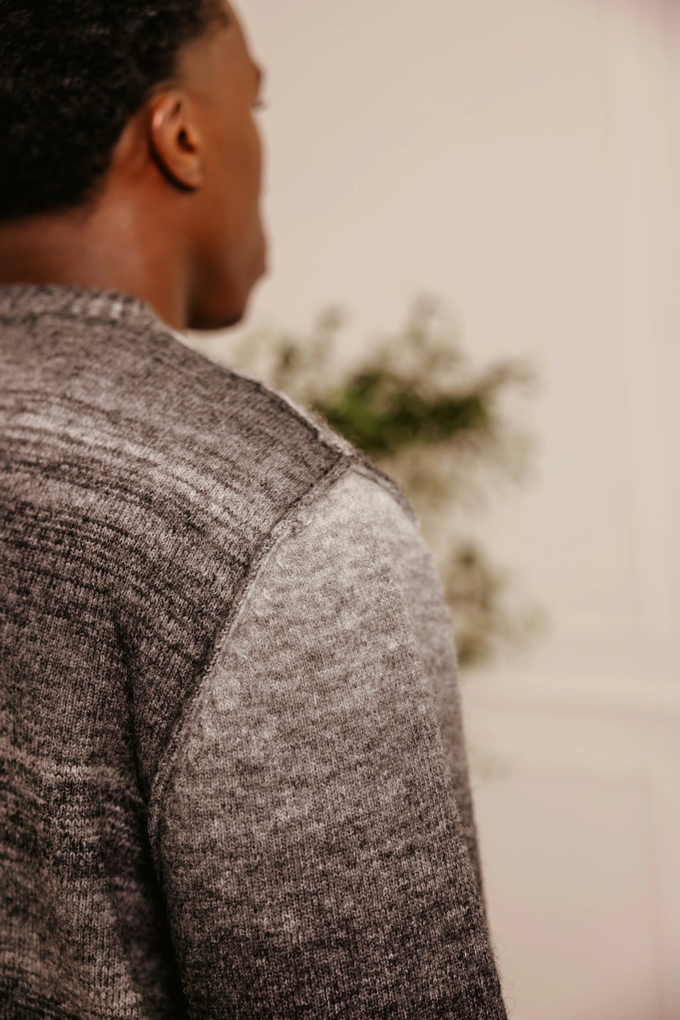 Charcoal Mist alpaca wool gradient knit sweater — exposed shoulder seam and knit texture detail