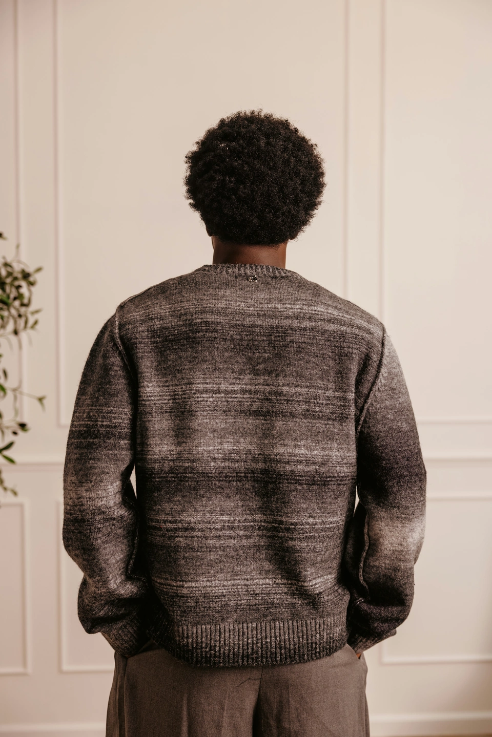 Charcoal Mist alpaca wool gradient knit sweater — male model, back view showing the gradient knit