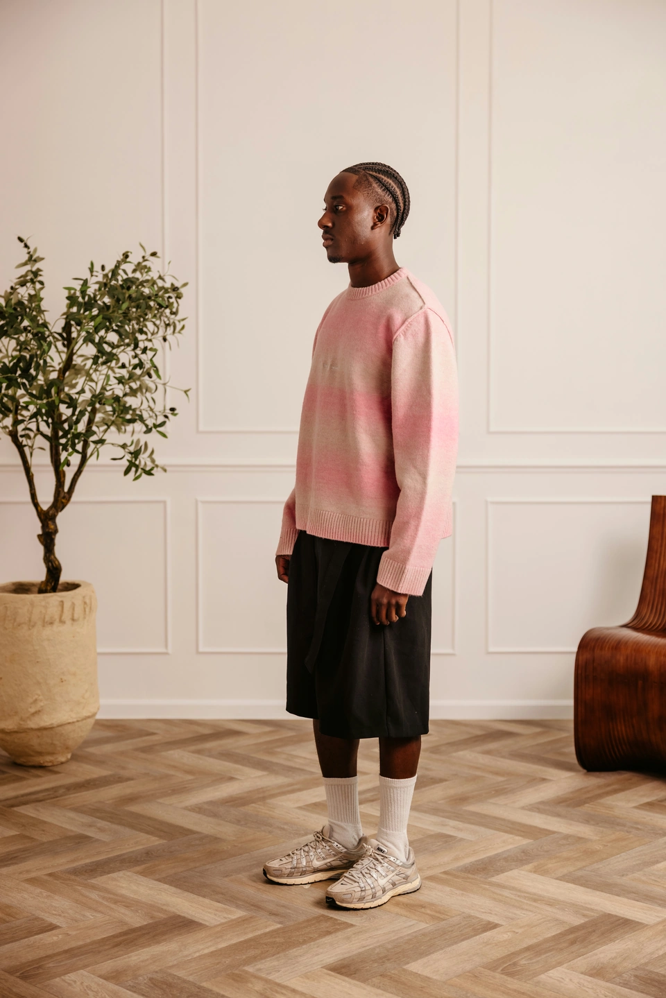 Soft Dawn Pink alpaca wool gradient knit sweater — male model, side view
